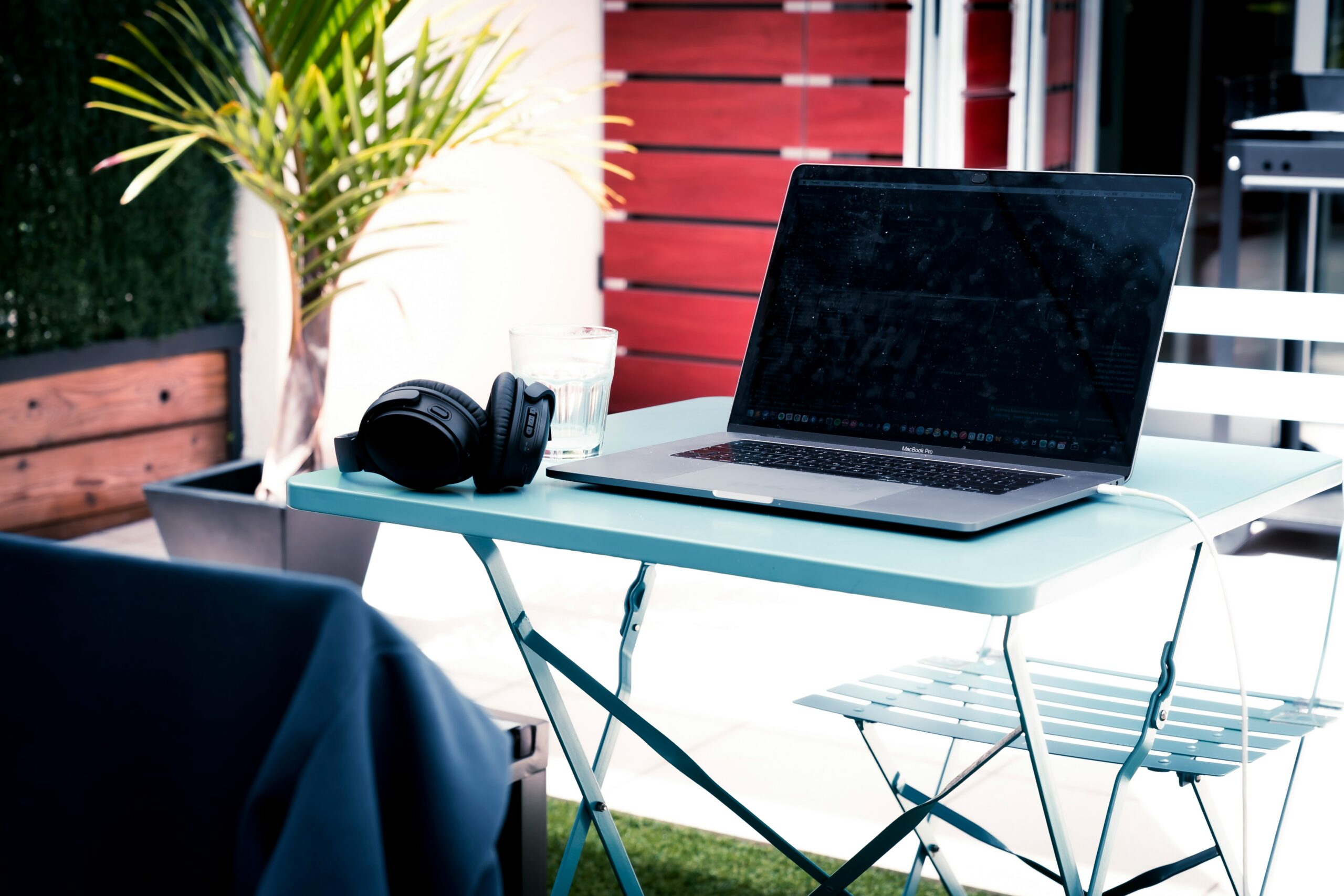 A laptop outside on a table, to reflect the heatwaves as one of June's HR Marketing insights